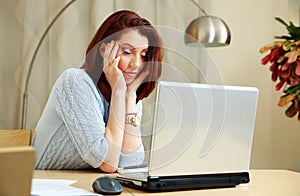 Tired woman with closing eyes sitting