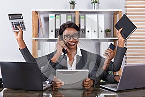 Tired Woman Doing Multitasking Work On Laptop