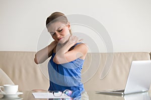 Tired woman feeling neck pain, sedentary work, incorrect posture