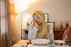 tired woman having break fast or sahur in the morning