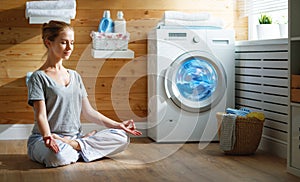 Tired woman housewife in stress meditates in lotus yoga pose in