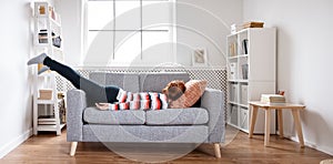 Tired woman lying on the sofa after hard day.