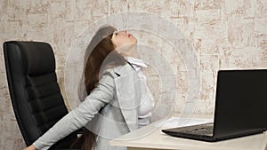 Tired woman office worker sleeping on the desk at work. business woman was weakened at work and fell asleep at the