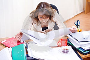 Tired woman reading papers