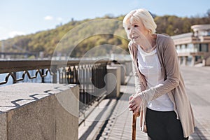 Tired woman relaxing in the street