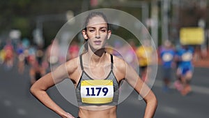 Tired woman run marathon. Exhausted female runner jog. Jogger girl look camera.