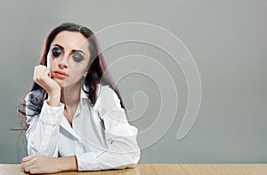 Tired woman sitting at the desk