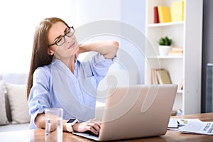 Tired woman working at the table