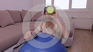 Tired woman after workout near stability ball