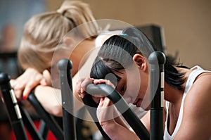 Tired women in gym photo