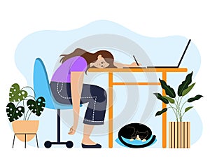 Tired from work, the girl put her head on a table with a computer, a home office with a sleeping cat and indoor plants.