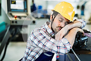 Tired worker fall asleep during working hours in factory