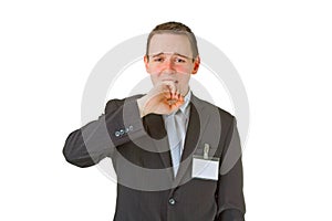 Tired young businessman yawning photo