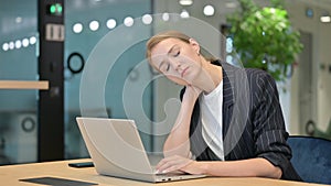 Tired Young Businesswoman with Laptop having Neck Pain