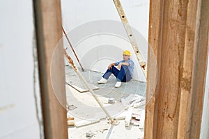 Exhausted Construction Worker Taking Break