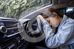 Tired young woman sleep in car, Hard work causes poor health, overworked concept