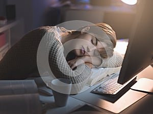 Tired woman sleeping on the desk