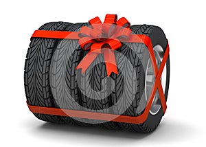 Tires as a gift. Tires with disks are tied with a red gift ribbon. isolated on white background. 3d render