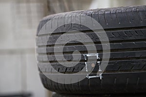 Tires on the floor are damaged by hitting nails or sharp objects, resulting in leakage of rubber and can not be run