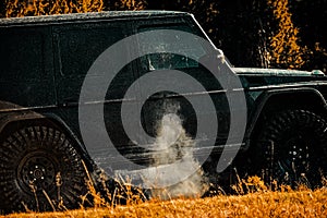 Tires in preparation for race. Off-road vehicle goes on the mountain. Mudding is off-roading through an area of wet mud photo