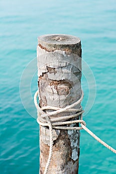 Tires and rope tied to a coconut mooring mast ship.