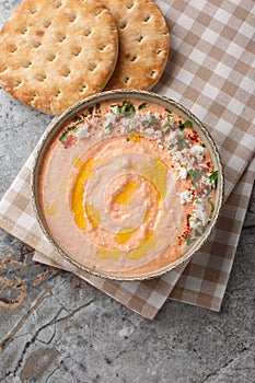 Tirokafteri Spicy Feta Dip spicy, creamy, tangy mezze from northern Greece closeup on the bowl. Vertical top view photo