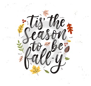 Tis` the season to be fall-y lettering card with colorful leaves and grunge effect