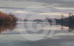 Tisa river,fisher boat in autumn november afternoon