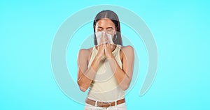 Tissue, blow nose and woman isolated on a blue background for virus, sick or healthcare safety or allergies. Sinus
