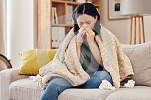 Tissue, blow nose and woman on sofa for home self care with virus, sick and healthcare or allergies. Sinus, flu and