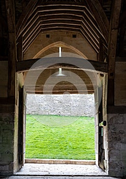 The Tithe Barn on Pound Lane, medieval stone barn in the Barton Grange complex on the River Avon in Bradford on Avon, Wiltshire UK