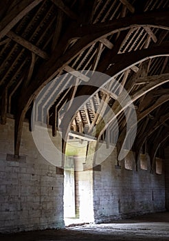 The Tithe Barn on Pound Lane, medieval stone barn in the Barton Grange complex on the River Avon in Bradford on Avon, Wiltshire UK