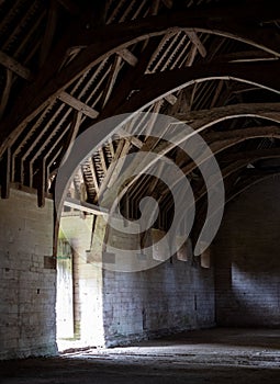 The Tithe Barn on Pound Lane, medieval stone barn in the Barton Grange complex on the River Avon in Bradford on Avon, Wiltshire UK