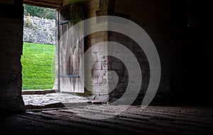 The Tithe Barn on Pound Lane, medieval stone barn in the Barton Grange complex on the River Avon in Bradford on Avon, Wiltshire UK