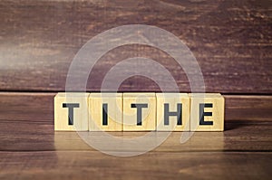 Tithe - words from wooden blocks with letters, one-tenth part tax to the Church tithe concept