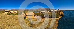 Titicaca lake Peru Uro huts on floating island PANORAMA