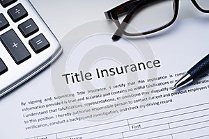 Title Insurance Form Over White Desk