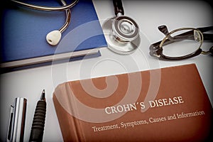 Titled book Crohn`s Disease along with medical equipment photo