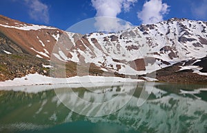 Titov peak and lake in Tian Shan mountains in Kazakhstan
