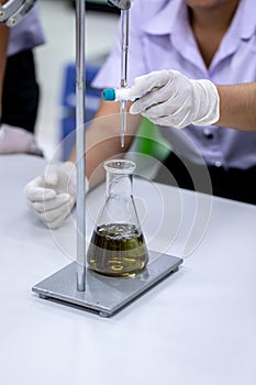 Titration technique in the laboratory.