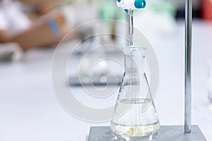 Titration technique in the laboratory.