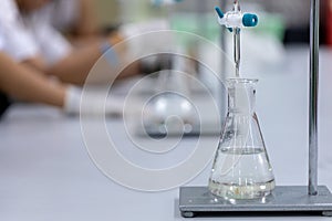 Titration technique in the laboratory.