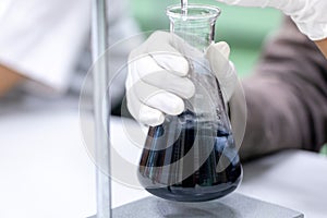 Titration technique in the laboratory.