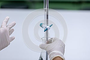 Titration technique in the laboratory.