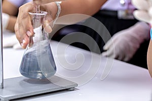 Titration technique in the laboratory.