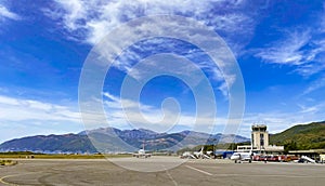 Tivat airport with aiplanes and mountains
