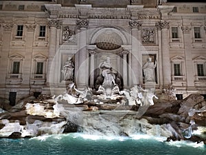 Tivoli fountain made of white Carrara marble in the evening