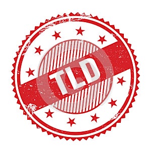 TLD text written on red grungy round stamp