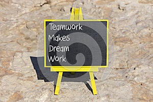 TMDW Teamwork makes dream work symbol. Concept words TMDW Teamwork makes dream work on black chalk blackboard on beautiful stone