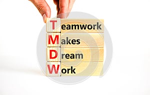 TMDW Teamwork makes dream work symbol. Concept words TMDW Teamwork makes dream work on wooden block on beautiful white background